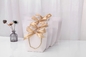 لوگوی مهر زنی کیف خرید لوازم آرایشی و بهداشتی پاپیونی روبانی کیف هدیه سفید